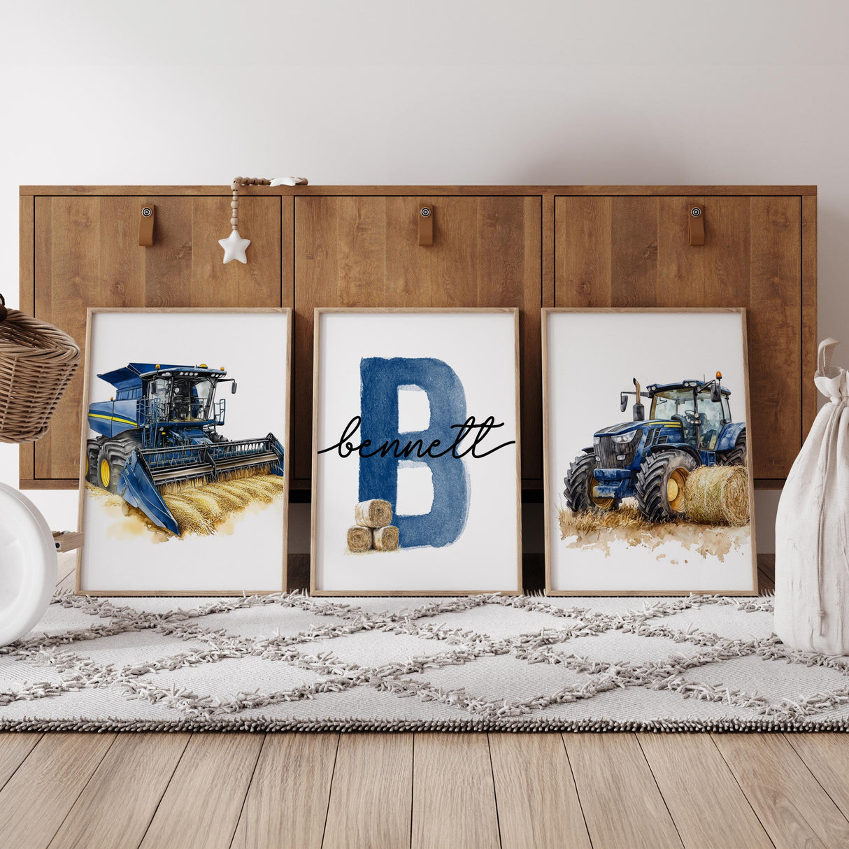 Farm nursery prints displayed above a crib